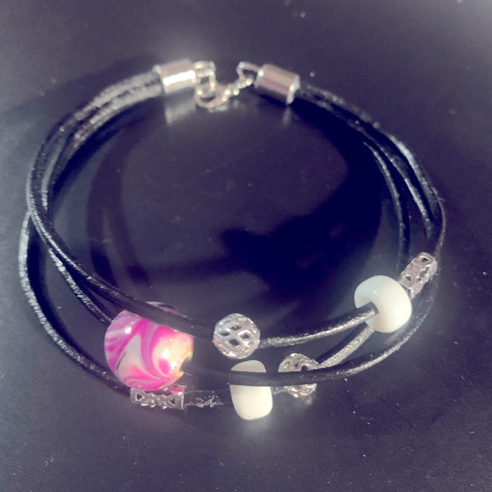 Hand crafted by me K.B.  Leather pink beaded bracelet made with groovy love.